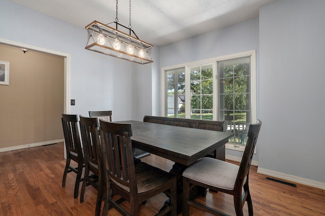 dining area featuring dark hardwood / wood-style floors