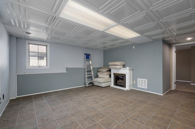 basement featuring tile patterned flooring