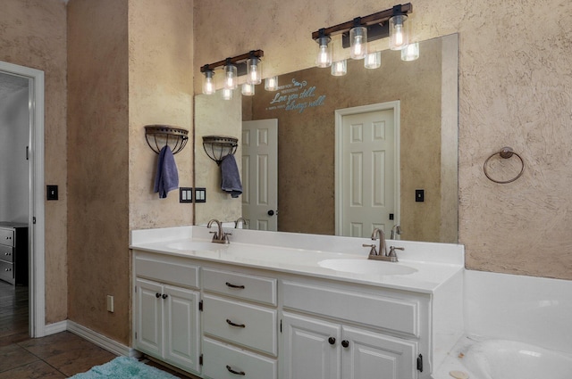 bathroom with vanity, tile patterned flooring, and a bathing tub