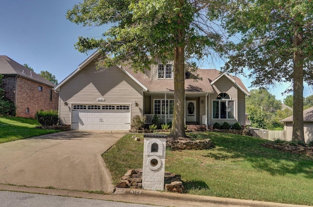 view of front of home featuring a front lawn and a garage