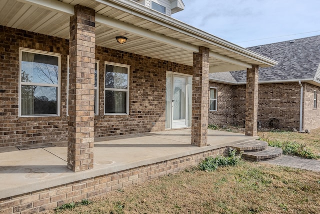 entrance to property featuring a patio