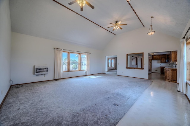 unfurnished living room featuring ceiling fan, light colored carpet, high vaulted ceiling, baseboards, and heating unit