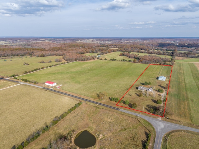 birds eye view of property featuring a rural view