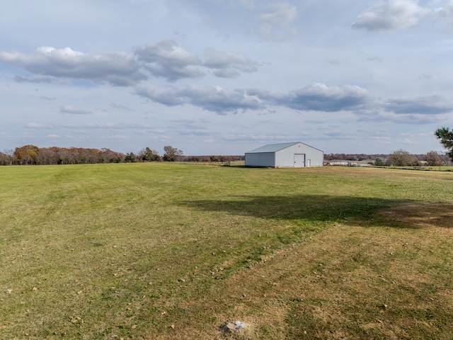 view of yard with a rural view