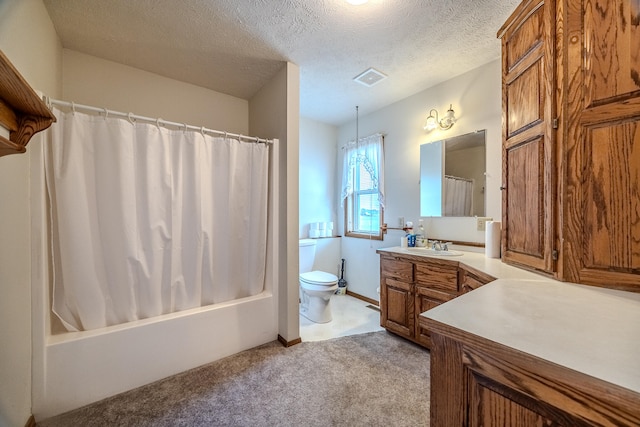 full bathroom with vanity, shower / tub combo with curtain, a textured ceiling, and toilet