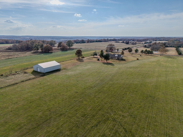 birds eye view of property featuring a rural view