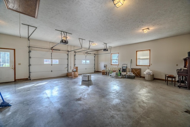 garage featuring baseboards and a garage door opener