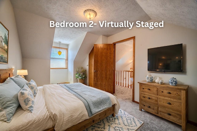 bedroom with light carpet, lofted ceiling, and a textured ceiling