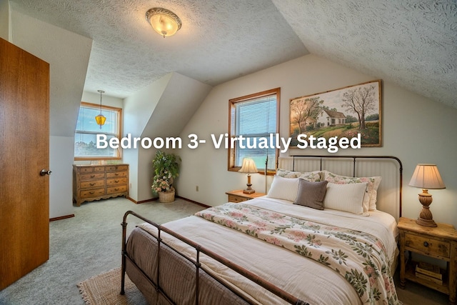 carpeted bedroom with lofted ceiling and a textured ceiling