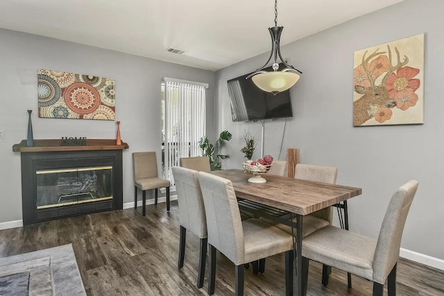 dining space featuring dark hardwood / wood-style floors