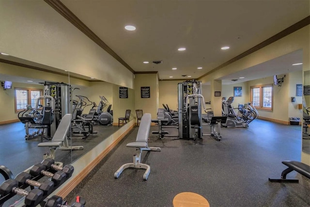 exercise room with ornamental molding and plenty of natural light