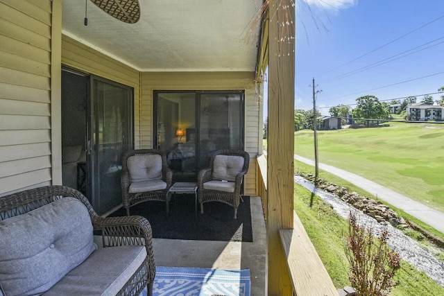 view of patio / terrace with an outdoor living space and ceiling fan