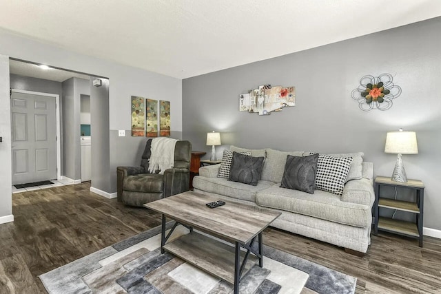 living room with dark hardwood / wood-style floors