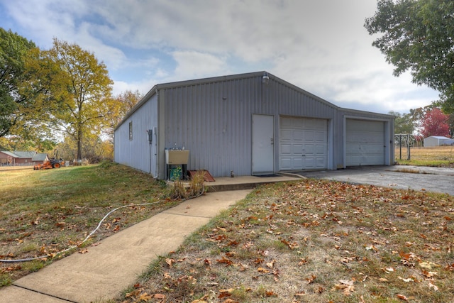 garage featuring a yard