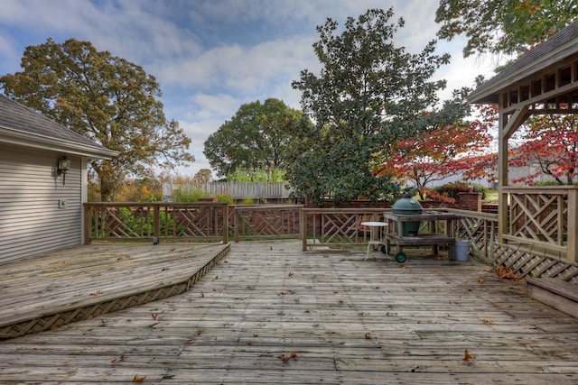 wooden deck featuring area for grilling