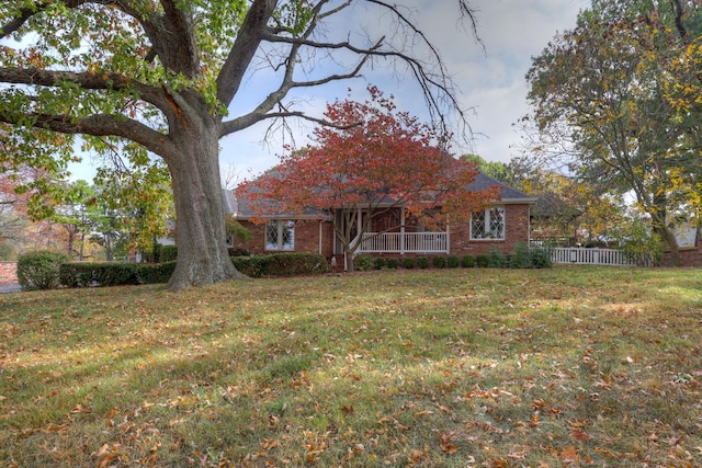 view of front of home with a front yard