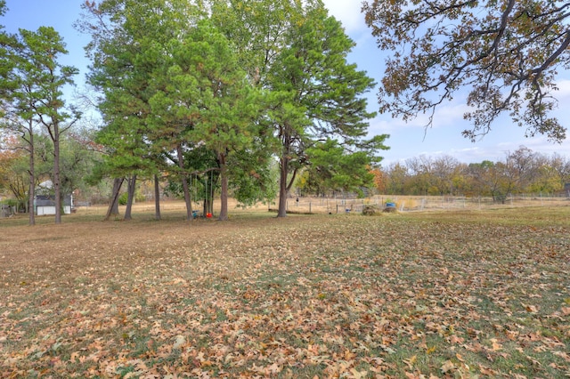 view of yard with a rural view