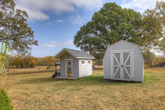 view of outdoor structure with a lawn