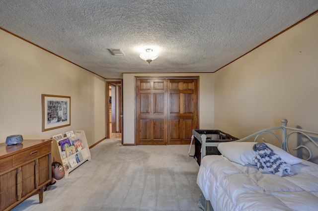 carpeted bedroom featuring a textured ceiling