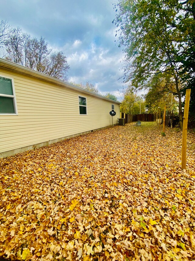 view of property exterior with central AC