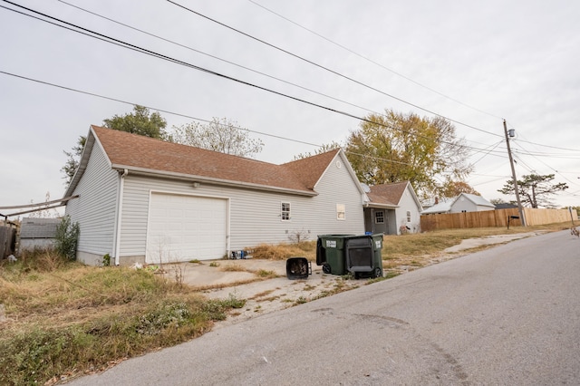 view of side of property featuring a garage