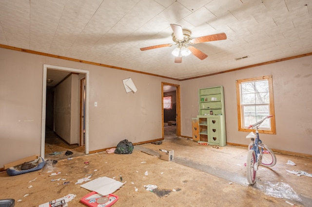 empty room with crown molding and ceiling fan