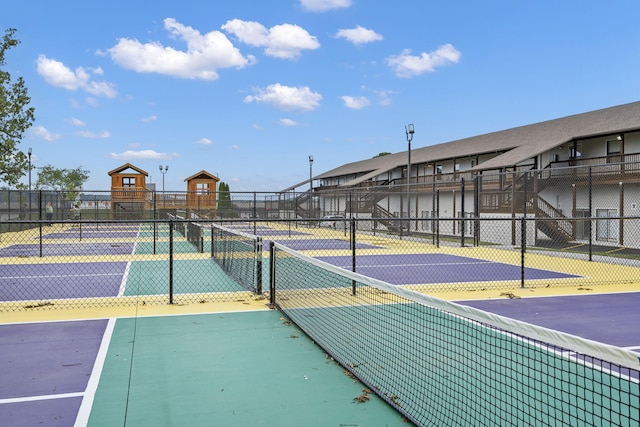 view of sport court featuring basketball hoop