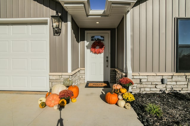 view of exterior entry featuring a garage