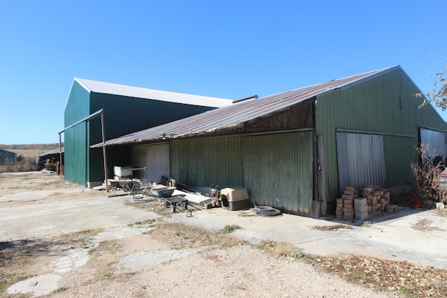 1819 Pleasant Hill Rd, Seymour, MO 65746 - view of property exterior featuring an outbuilding, an outdoor structure, and metal roof