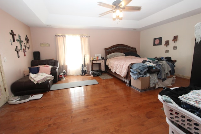 1819 Pleasant Hill Rd, Seymour, MO 65746 - bedroom featuring a raised ceiling, wood finished floors, and ceiling fan