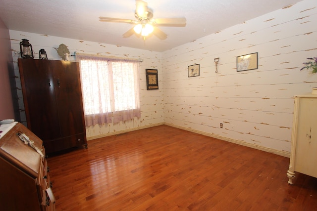 1819 Pleasant Hill Rd, Seymour, MO 65746 - spare room with ceiling fan, wood finished floors, and baseboards