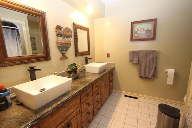 1819 Pleasant Hill Rd, Seymour, MO 65746 - bathroom featuring double vanity, baseboards, tile patterned flooring, and toilet
