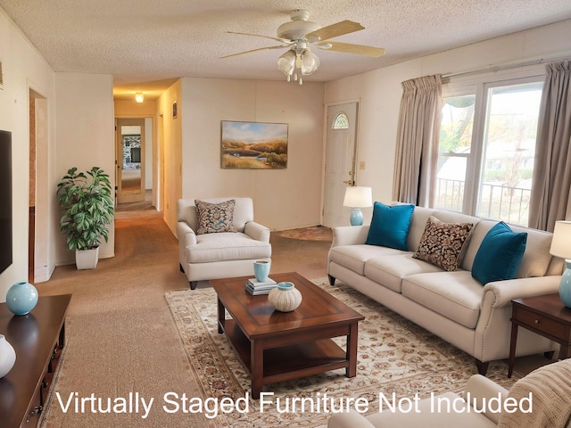 living room with light carpet, a textured ceiling, and ceiling fan