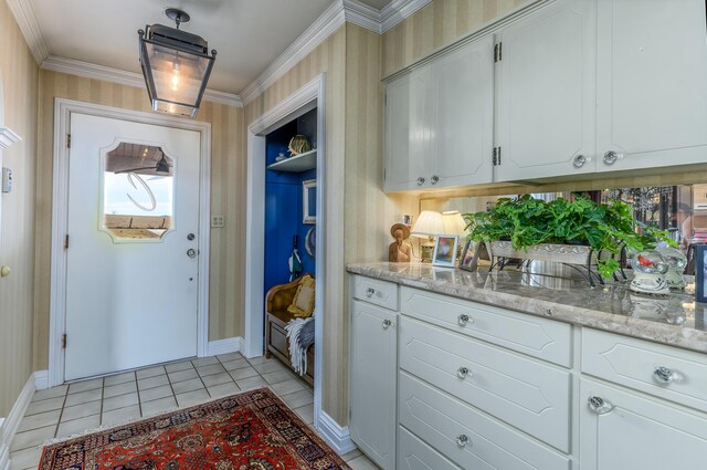 15778 Lawrence Unit 2130, Mount Vernon, MO 65712 - doorway featuring ornamental molding, light tile patterned floors, baseboards, and wallpapered walls