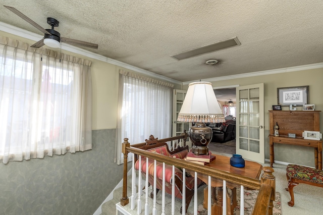 15778 Lawrence Unit 2130, Mount Vernon, MO 65712 - carpeted living room with a ceiling fan, ornamental molding, a textured ceiling, and french doors