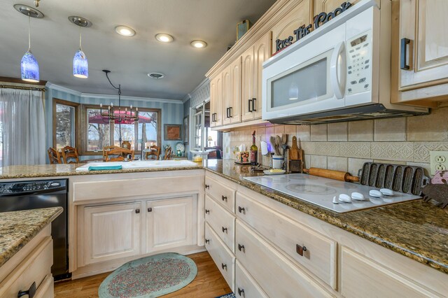 15778 Lawrence Unit 2130, Mount Vernon, MO 65712 - kitchen with white appliances, stone countertops, backsplash, recessed lighting, and a peninsula