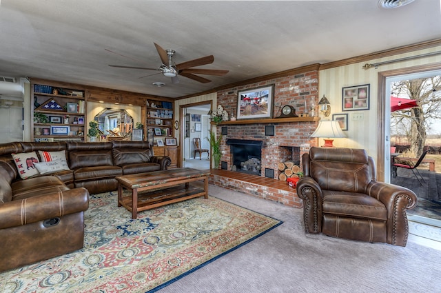 carpeted living room featuring ornamental molding, a brick fireplace, a textured ceiling, and ceiling fan