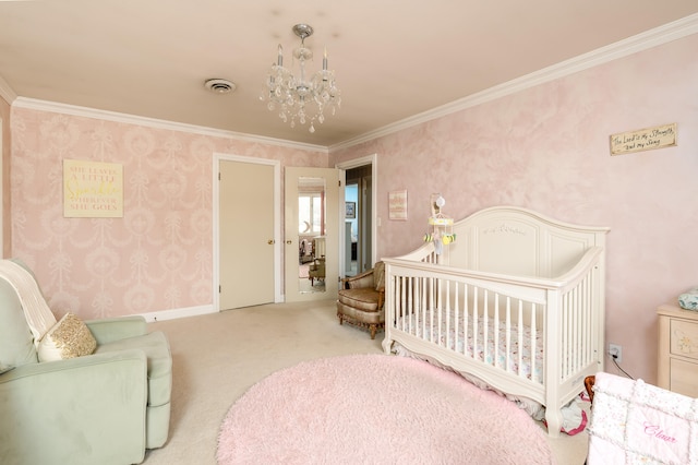 carpeted bedroom featuring ornamental molding, an inviting chandelier, and a nursery area