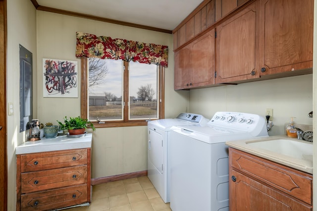 15778 Lawrence Unit 2130, Mount Vernon, MO 65712 - laundry room with cabinet space, washing machine and dryer, crown molding, and light tile patterned floors