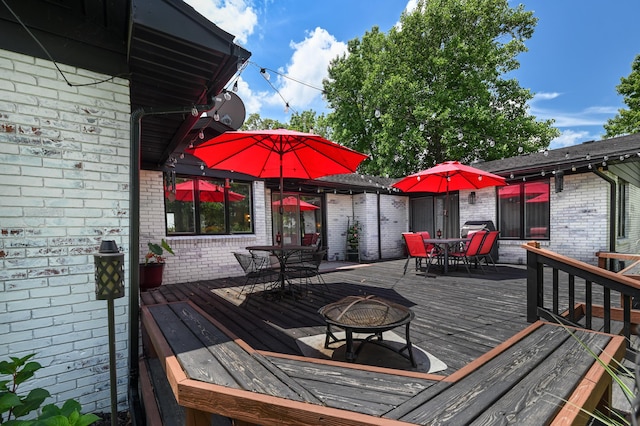 15778 Lawrence Unit 2130, Mount Vernon, MO 65712 - deck featuring outdoor dining space and a fire pit