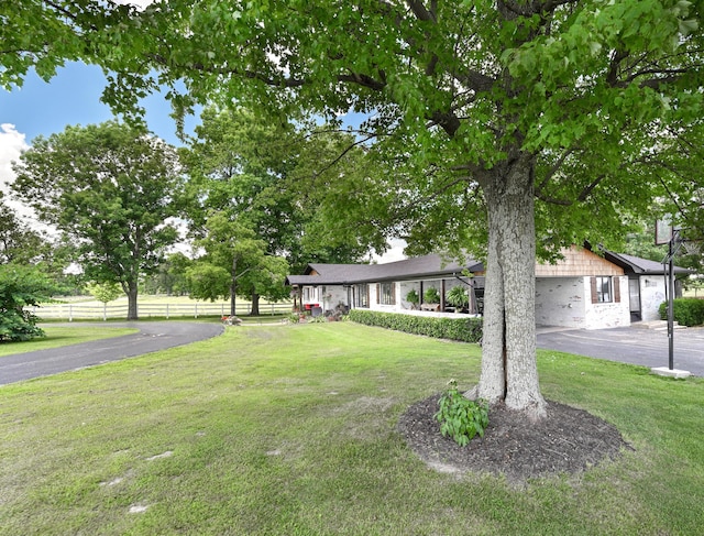 15778 Lawrence Unit 2130, Mount Vernon, MO 65712 - ranch-style home featuring driveway, an attached garage, and stone siding