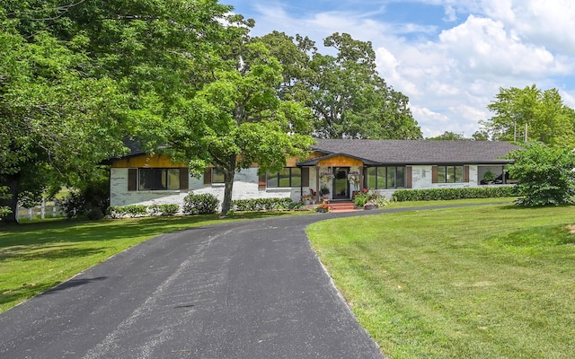 15778 Lawrence Unit 2130, Mount Vernon, MO 65712 - view of front of property featuring a front lawn and asphalt driveway