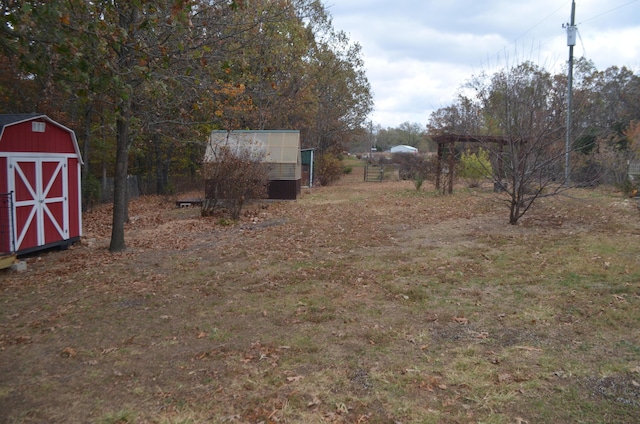 4435 Olga Rd, Fordland, MO 65652 - view of yard featuring a storage shed and an outbuilding