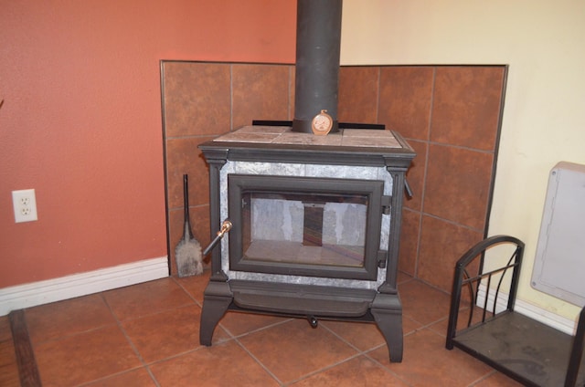 4435 Olga Rd, Fordland, MO 65652 - details featuring baseboards and a wood stove