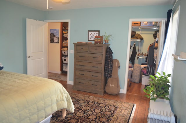 4435 Olga Rd, Fordland, MO 65652 - bedroom featuring a closet, baseboards, a spacious closet, and hardwood / wood-style flooring