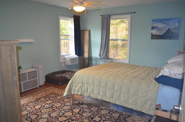 4435 Olga Rd, Fordland, MO 65652 - bedroom featuring ceiling fan, radiator heating unit, and wood finished floors