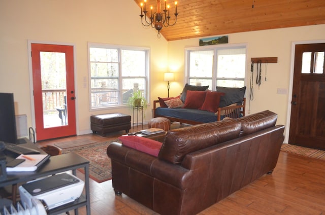 4435 Olga Rd, Fordland, MO 65652 - living area with lofted ceiling, a chandelier, and hardwood / wood-style floors