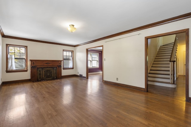 unfurnished living room with crown molding and dark hardwood / wood-style flooring