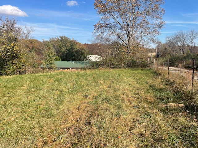 view of yard with a rural view