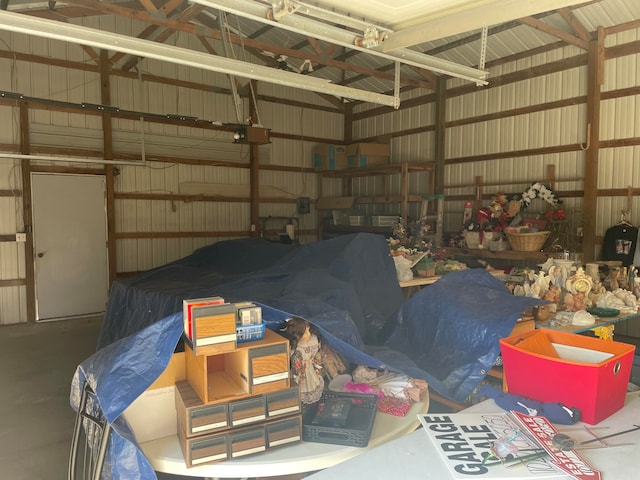 garage featuring wood walls